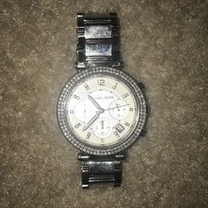 A women’s silver Michael Kors watch !!
